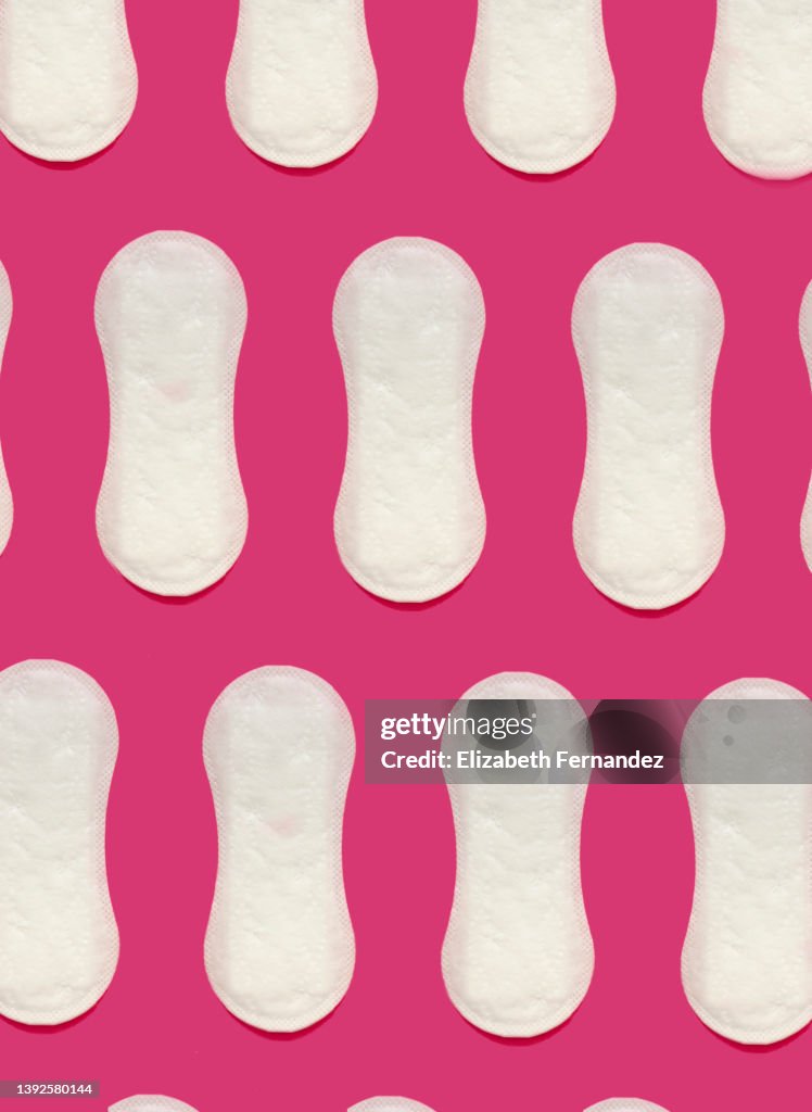 Seamless pattern of sanitary pad on pink background