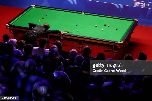 Jack Lisowski of England plays a shot during the Betfred World Snooker Championship Round One match between Matthew Stevens of Wales and Jack...