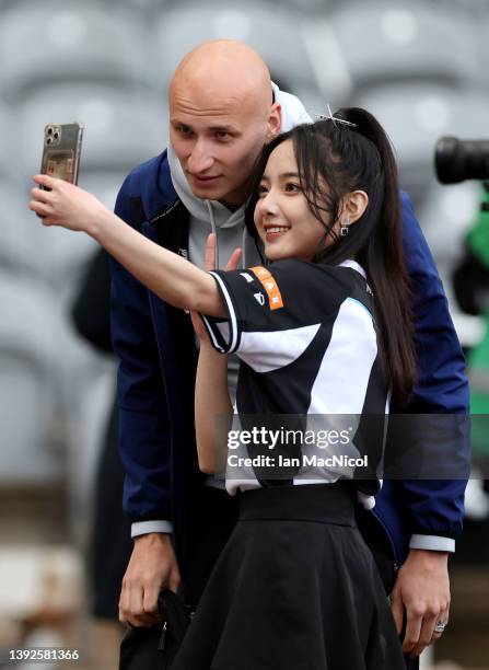 Newcastle United fan takes a photograph with Jonjo Shelvey of Newcastle United as he arrives at the stadium prior to the Premier League match between...