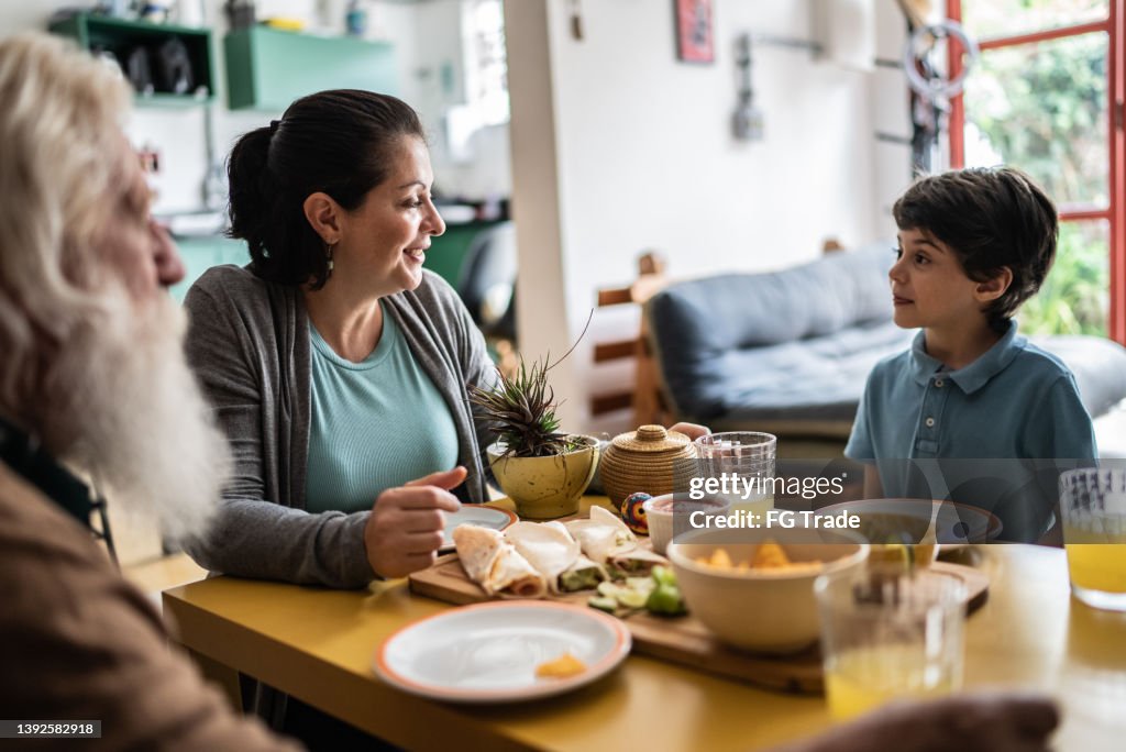 Family eating mexican food at home
