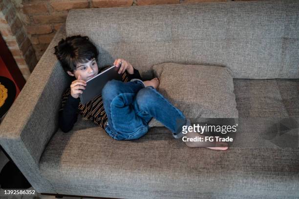 boy using digital tablet at home - free download photo stock pictures, royalty-free photos & images