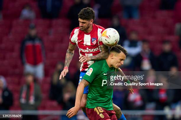 Rodrigo de Paul of Atletico de Madrid battles for the ball with Njegos Petrovic of Granada CF during the LaLiga Santander match between Club Atletico...