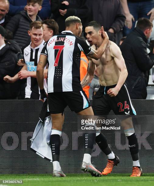 Miguel Almiron of Newcastle United celebrates after scoring their side's first goal with Joelinton during the Premier League match between Newcastle...