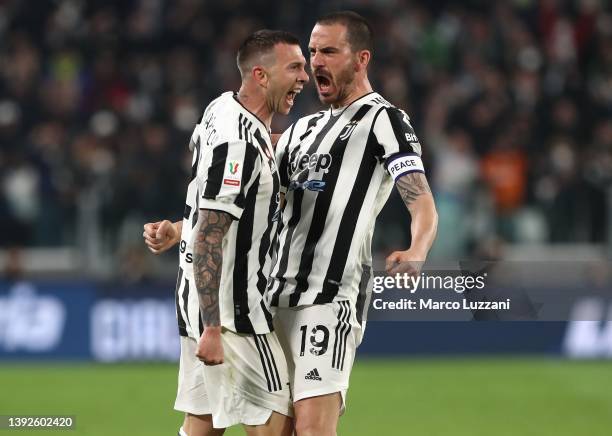 Federico Bernardeschi of Juventus FC celebrates with his team-mate Leonardo Bonucci after scoring the opening goal during the Coppa Italia Semi Final...