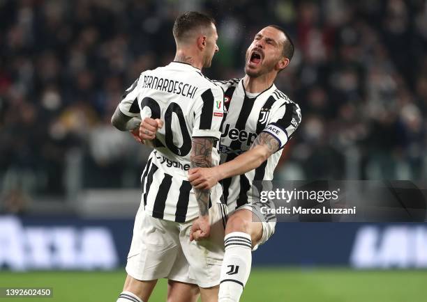 Federico Bernardeschi of Juventus FC celebrates with his team-mate Leonardo Bonucci after scoring the opening goal during the Coppa Italia Semi Final...