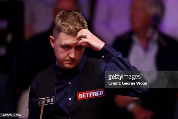 Kyren Wilson of England reacts during the Betfred World Snooker Championship Round One match between Kyren Wilson of England and Ding Junhui of China...