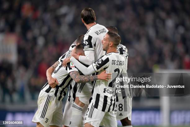 Federico Bernardeschi of Juventus celebrates with teammates after scoring his team's first goal during the Coppa Italia Semi Final 2nd Leg match...