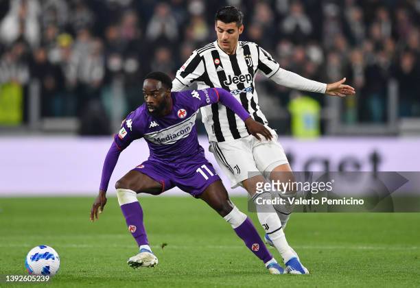Jonathan Ikone of Fiorentina battles for possession with Alvaro Morata of Juventus during the Coppa Italia Semi Final 2nd Leg match between Juventus...