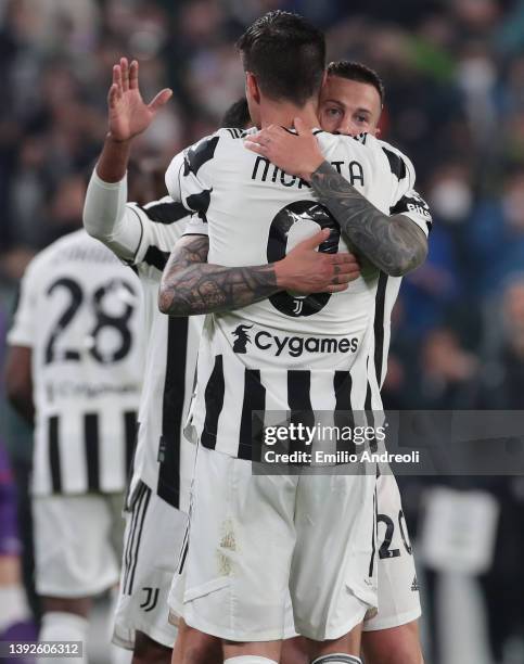 Federico Bernardeschi of Juventus celebrates with his team-mate Alvaro Morata after scoring the opening goal during the Coppa Italia Semi Final 2nd...