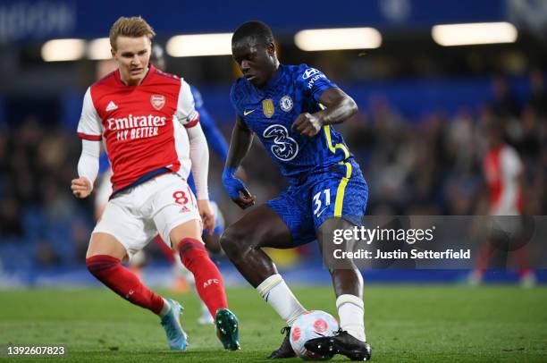 Malang Sarr of Chelsea is challenged by Martin Oedegaard of Arsenal during the Premier League match between Chelsea and Arsenal at Stamford Bridge on...