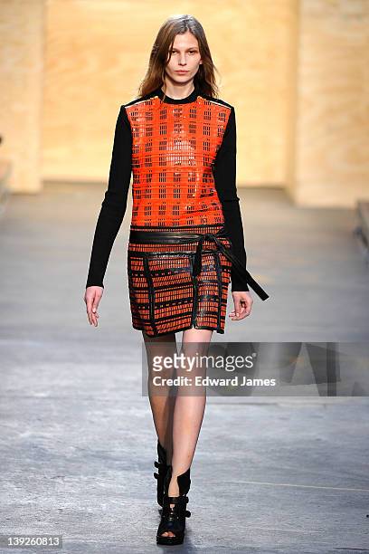 Model walks the runway at the Proenza Schouler Fall 2012 fashion show during Mercedes-Benz Fashion Week on February 15, 2012 in New York City.