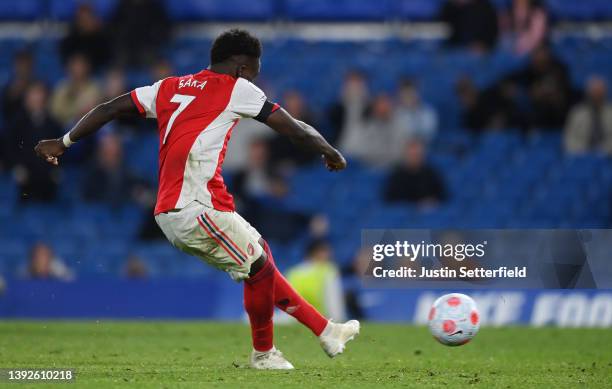 Bukayo Saka of Arsenal scores their team's fourth goal from the penalty spot during the Premier League match between Chelsea and Arsenal at Stamford...