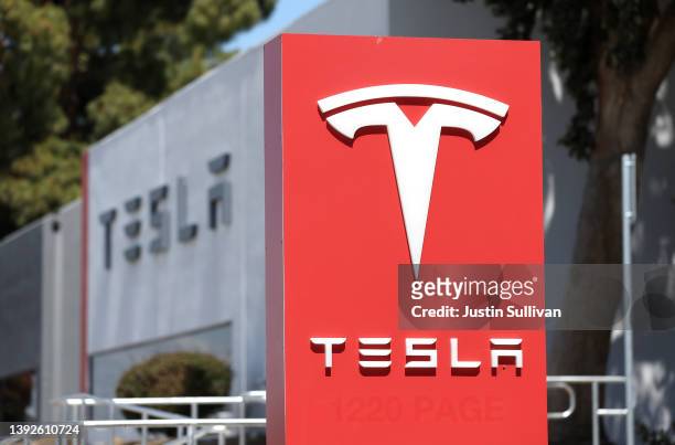Sign is posted in front of a Tesla service center on April 20, 2022 in Fremont, California. Tesla reported first quarter earnings that far exceeded...