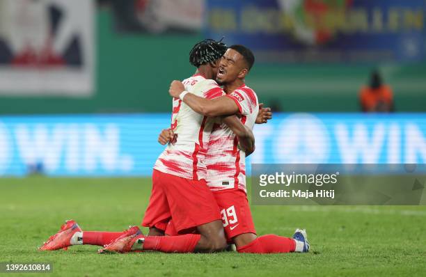 Mohamed Simakan and Benjamin Henrichs of RB Leipzig celebrates their side's victory after the DFB Cup semi final match between RB Leipzig and 1. FC...