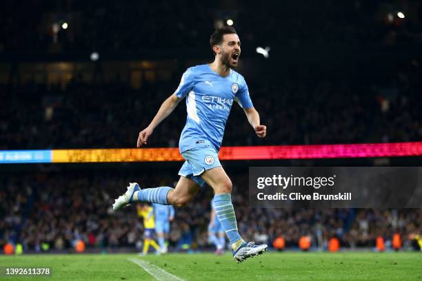 Bernardo Silva of Manchester City celebrates after scoring their team's third goal during the Premier League match between Manchester City and...