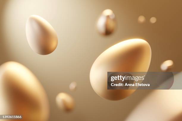many golden easter eggs flying on golden background. modern luxury easter backdrop with copy space for your design - flying egg stock pictures, royalty-free photos & images