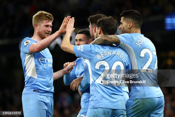 Bernardo Silva celebrates with Kevin De Bruyne of Manchester City after scoring their team's third goal during the Premier League match between...