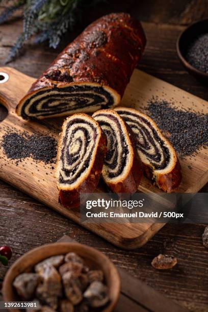 traditional hungarian beigli roll,high angle view of bread on table - paastaart stockfoto's en -beelden