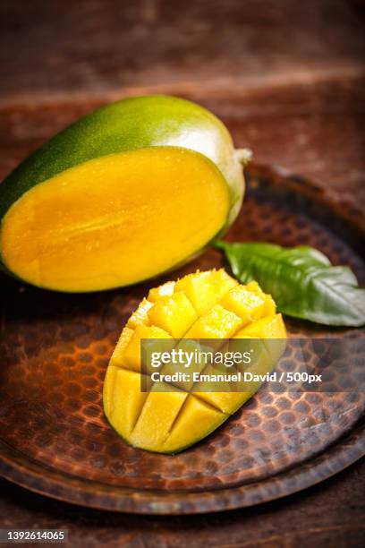 mango slice,close-up of fruits in plate on table - mangoes stock pictures, royalty-free photos & images