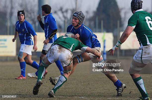 Andrea Gobbo of Italy U18 is challenged by Joe Bercis of Ireland U18 during the U18 rugby test match between Italy U18 and Ireland U18 on February...