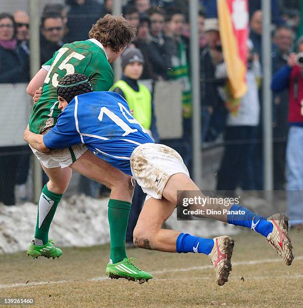 Adrian Enright of Ireland U18 is takled by Gabriele Di Giulio of Italy U18 during the U18 rugby test match between Italy U18 and Ireland U18 on...