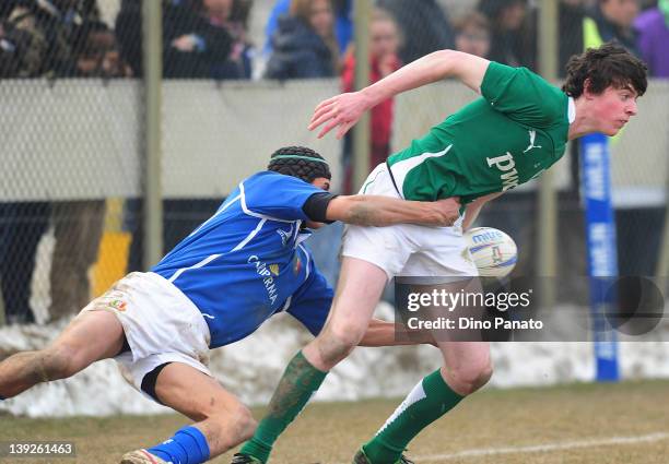 Jim Withe of Ireland U18 is takled by Gabriele Di Giulio of Italy U18 during the U18 rugby test match between Italy U18 and Ireland U18 on February...