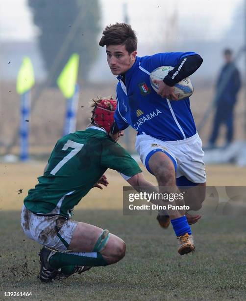Bruno Lorenzo of Italy U18 tries to tackle to Joe Bercis of Ireland U18 during the U18 rugby test match between Italy U18 and Ireland U18 on February...
