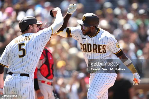 Wil Myers congratultes Jurickson Profar of the San Diego Padres after his solo homerun during the fourth inning of a game against the Cincinnati Reds...