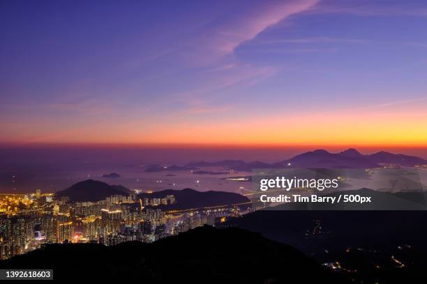 crazy moment,high angle view of illuminated city against sky at sunset,hong kong - amazing moment in the nature stock-fotos und bilder