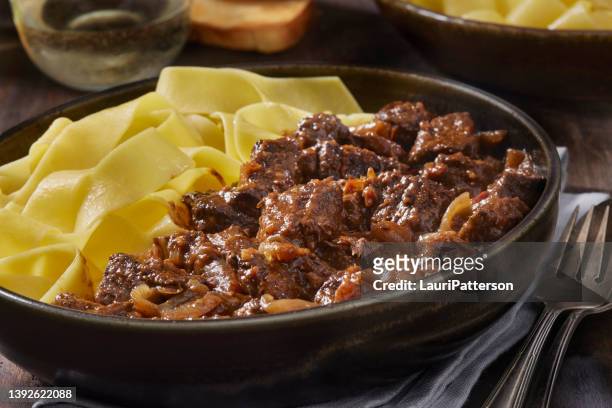 hungarian goulash with pappardelle - hungarian culture stock pictures, royalty-free photos & images