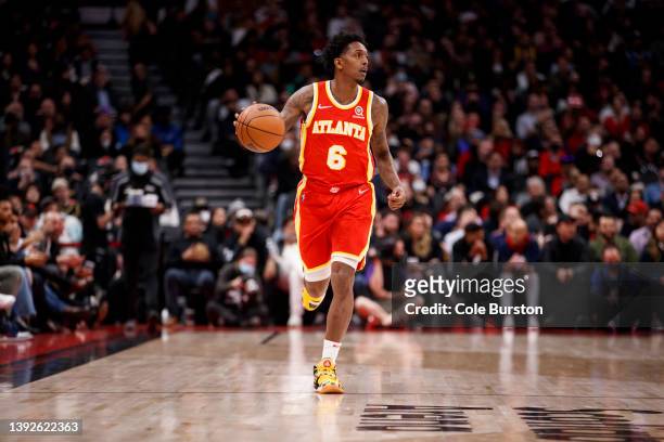 Lou Williams of the Atlanta Hawks dribbles up court during the first half of their NBA game at Scotiabank Arena on April 5, 2022 in Toronto, Canada....