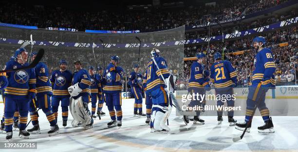 Buffalo Sabres players and fans celebrate a victory over the Nashville Predators in an NHL game on April 1, 2022 at KeyBank Center in Buffalo, New...