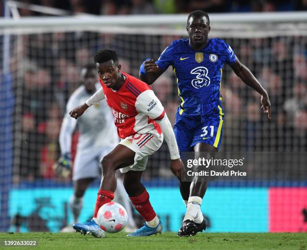 Eddie Nketiah of Arsenal is challenged by Malang Saar of Chelsea during the Premier League match between Chelsea and Arsenal at Stamford Bridge on...