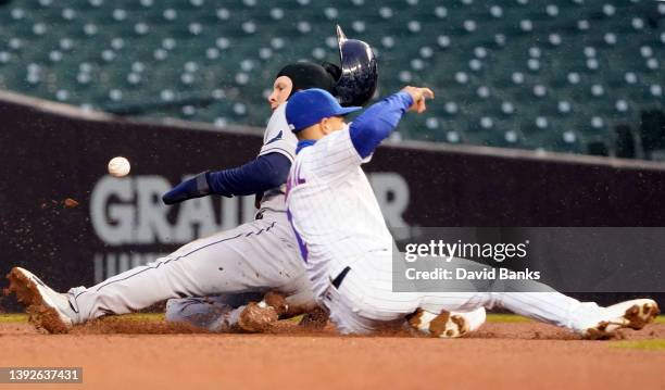 Taylor Walls of the Tampa Bay Rays steals second base as Nick Madrigal of the Chicago Cubs takes the throw during the fifth inning at Wrigley Field...