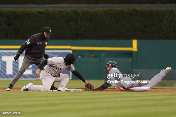 Victor Reyes of the Detroit Tigers is tagged out trying to steal second base in the second inning by Gleyber Torres of the New York Yankees at...