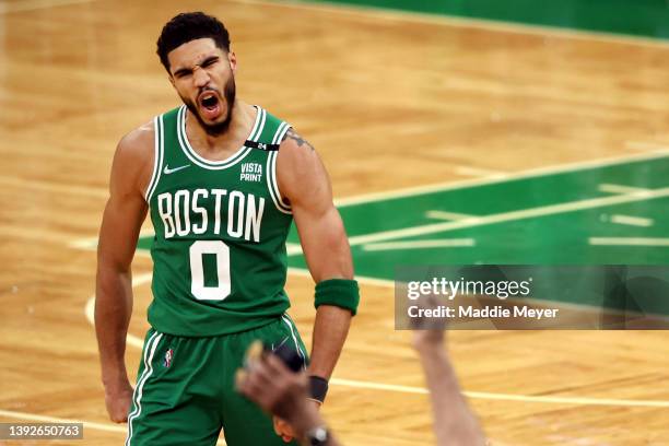 Jayson Tatum of the Boston Celtics celebrates after hitting a three point shot against the Brooklyn Nets during the fourth quarter of Game Two of the...