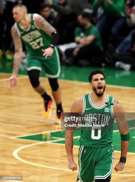 Jayson Tatum of the Boston Celtics celebrates after hitting a three point shot against the Brooklyn Nets during the fourth quarter of Game Two of the...