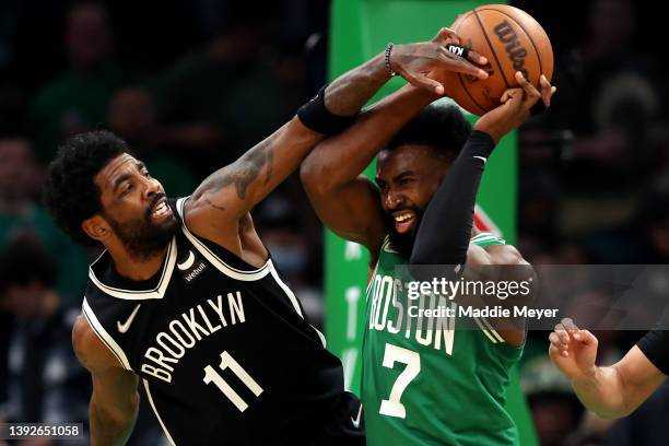 Kyrie Irving of the Brooklyn Nets defends Jaylen Brown of the Boston Celtics during the third quarter of Game Two of the Eastern Conference First...