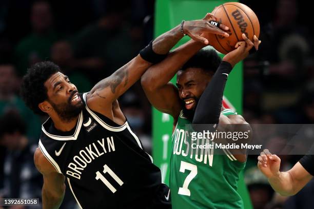 Kyrie Irving of the Brooklyn Nets defends Jaylen Brown of the Boston Celtics during the third quarter of Game Two of the Eastern Conference First...