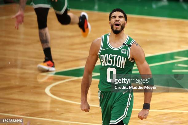 Jayson Tatum of the Boston Celtics celebrates after hitting a three point shot against the Brooklyn Nets during the fourth quarter of Game Two of the...