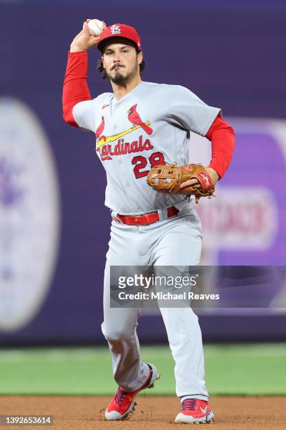 Nolan Arenado of the St. Louis Cardinals throws out a runner at first base against the Miami Marlins during the seventh inning at loanDepot park on...