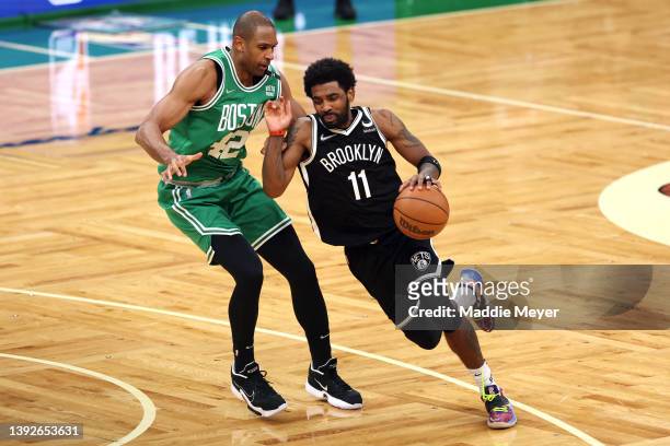 Kyrie Irving of the Brooklyn Nets drives to the basket past Al Horford of the Boston Celtics during the fourth quarter of Game Two of the Eastern...