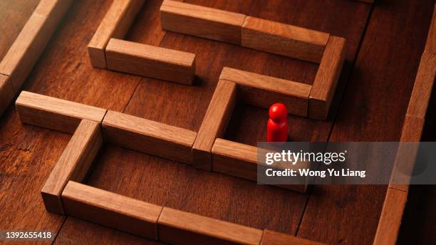 maze solution concept photo , difficult business decisions or solving problems - escaping maze stock pictures, royalty-free photos & images