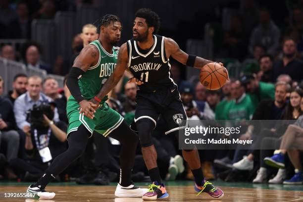 Marcus Smart of the Boston Celtics defends Kyrie Irving of the Brooklyn Nets during the second quarter of Game Two of the Eastern Conference First...