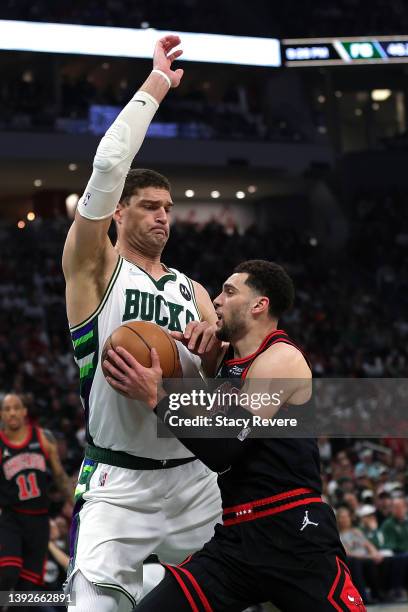 Zach LaVine of the Chicago Bulls is defended by Brook Lopez of the Milwaukee Bucks in the second quarter during Game Two of the Eastern Conference...