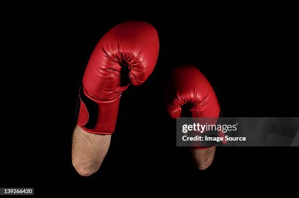 close up of boxers' arms and gloves - punching gloves stock pictures, royalty-free photos & images