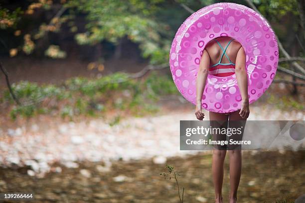 girl with inflatable ring - o stockfoto's en -beelden