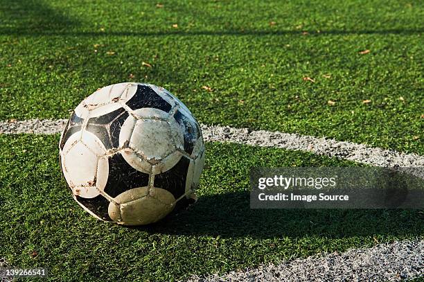 close up of a ball on a football pitch - close up gras stock-fotos und bilder