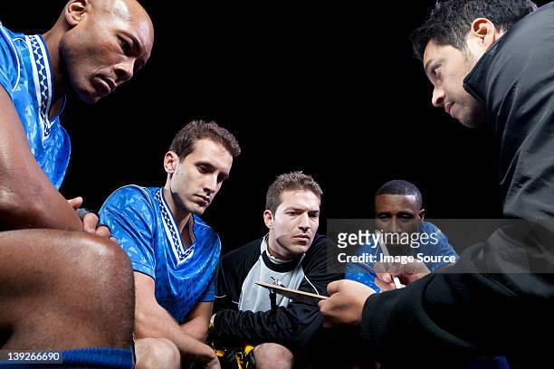 soccer team planning game with coach - coach stock pictures, royalty-free photos & images