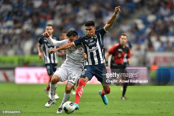 Jesús Gallardo of Monterrey fights for the ball with Aldo Rocha of Atlas during the 15th round match between Monterrey and Atlas as part of the...